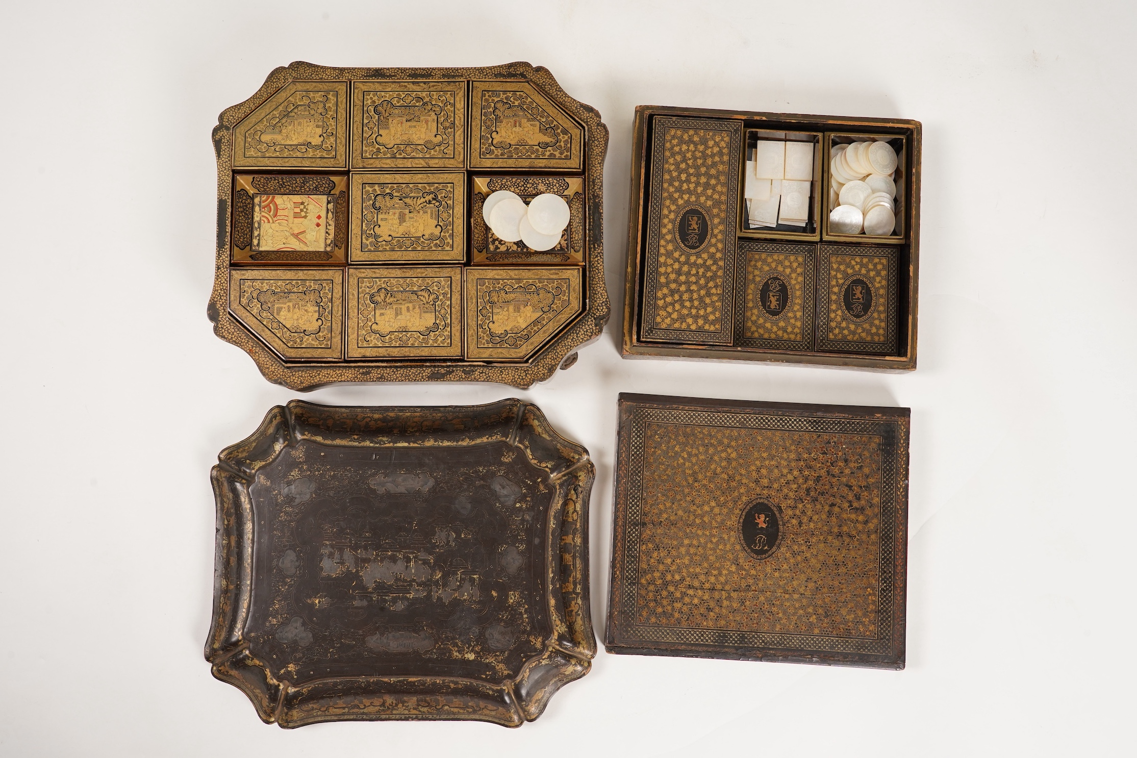 Two Chinese gilt decorated black lacquer games boxes, containing numerous mother-of-pearl counters, 19th century